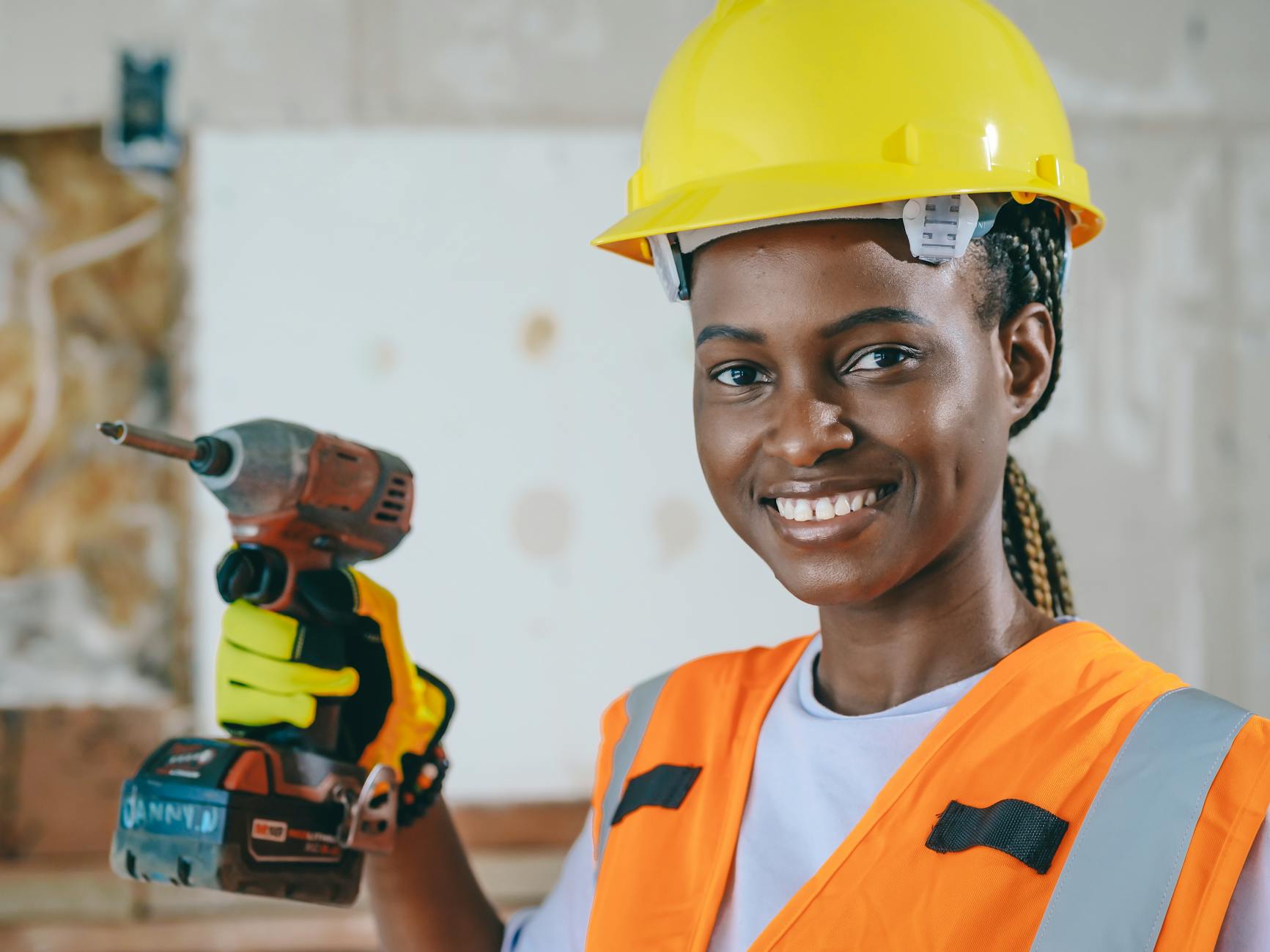 handywoman holding a drill